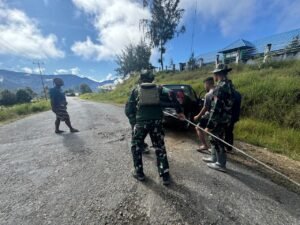 Initiative Of The Habema Soldiers To Help Pull A Stuck Civilian Vehicle In Mamba