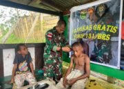 Tanamkan Kerapian Sejak Dini, Satgas Yonif 131/Brajasakti Berikan Layanan Pangkas Rambut Gratis Kepada Warga Perbatasan Papua