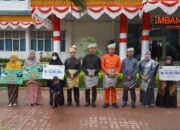 Pj Bupati Langkat Pimpin Upacara HUT Ke-275 Kabupaten Langkat: Dorong Kinerja ASN Dan Bagikan Santunan